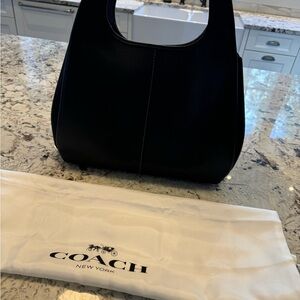 Coach “Lana” handbag. Basically brand new. Used twice.